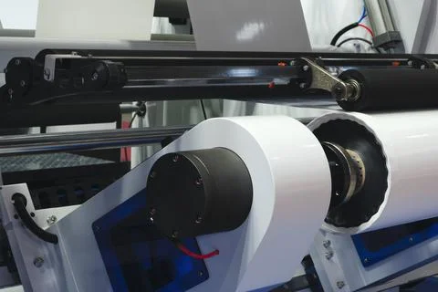 Automatic polyethylene plastic bag production machine with lighting effect. C Stock Photos