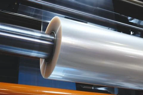 Automatic polyethylene plastic bag production machine with lighting effect. C Stock Photos