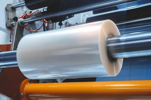 Automatic polyethylene plastic bag production machine with lighting effect. C Stock Photos