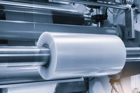 Automatic polyethylene plastic bag production machine with lighting effect. C Stock Photos