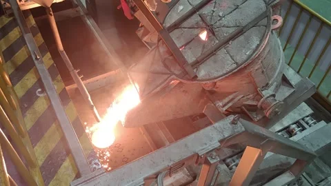 Automatic pouring equipment in a foundry is pouring molten iron into a sand mold Stock-Footage 277430044