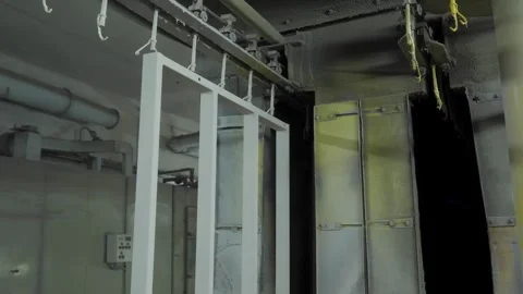 Automatic powder coating line for metal frames in factory Stock Footage 334661450