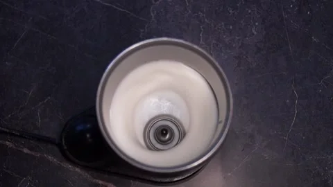 Automatic preparation of excellent foam for coffee. Black background. Stock Footage 203819349