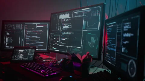 Automatic programming process on different computer monitors Stock Footage 257817378