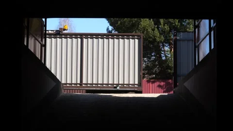 Automatic rc gates to the garage open and the car enters a private parking space Video stock 267614650