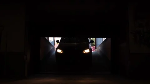 Automatic rc roller garage doors open and the car enters the private parking lot Stock Footage 267618280