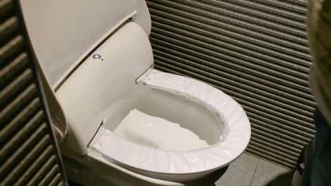 Automatic replacement disposable toilet seat covers. With sound. Stock Footage 81695405