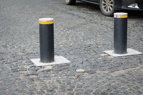 Automatic retractable bollard with glowing lights for control of road traffic Foto stock