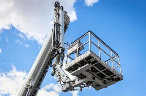 The automatic retractable boom of the construction machine, of the fire truck Stock Photos