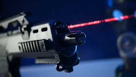 Automatic rifle on dark background with optical sight gas mask on dark Stock Footage 119169305