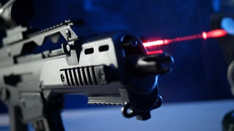 Automatic rifle on dark background with optical sight gas mask on dark Stock Footage 119169331