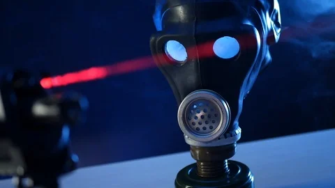 Automatic rifle on dark background with optical sight gas mask on dark Stock Footage 119169381