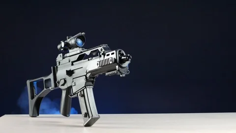 Automatic rifle on a dark background with a telescopic sight Stock Footage 117969994