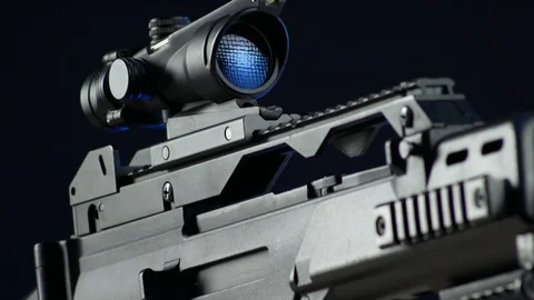 Automatic rifle on a dark background with a telescopic sight Stock Footage 117970000
