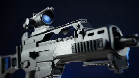 Automatic rifle on a dark background with a telescopic sight Stock Footage 117970023