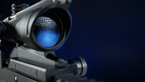 Automatic rifle on a dark background with a telescopic sight Stock Footage 117970055