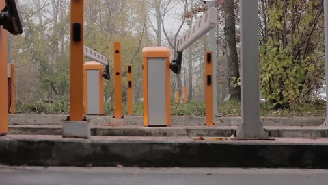 Automatic road barrier gate lifting gate opens and passes car Video stock 80764337