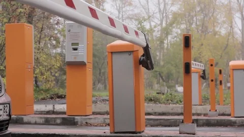 Automatic road barrier gate lifting gate opens and passes car Video stock 80764400