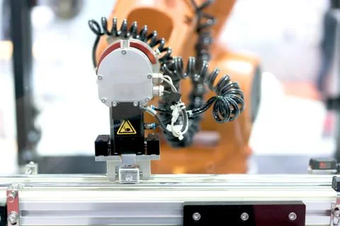 Automatic robot arm with imaging sensor in assembly line working in factory.  Stock Photos