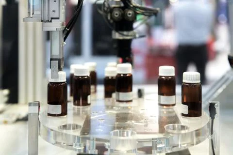 Automatic robot arm with imaging sensor in assembly line working in factory.  Stock Photos