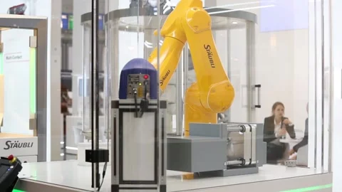 Automatic robot arm on Staubli stand on Messe fair in Hannover, Germany Stock Footage 97789556