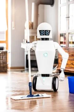 Automatic robot floor scrubber is doing his work Fotos Stock