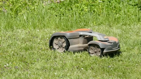 Automatic robot lawn mower mows lawns, Germany Video stock 276542530
