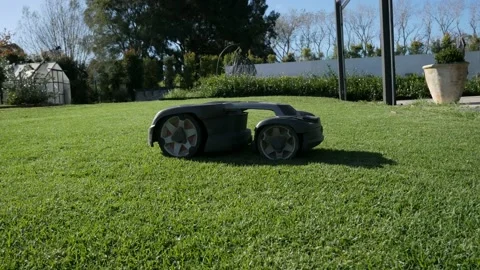 Automatic Robot Lawn Mower Side On Video stock 199203117