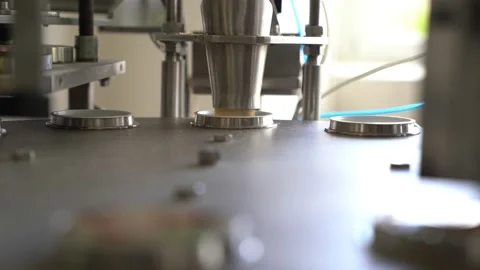 An automatic robot pours precise amounts of ingredients into molds. Stock Footage 195815976