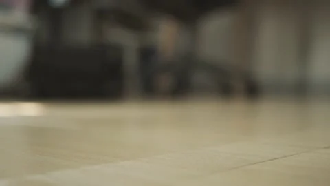 Automatic robot vacuum cleaner cleans the tile floor. Video stock 236821119