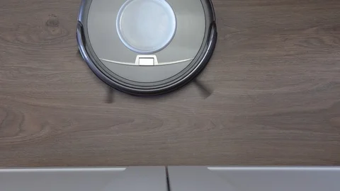 Automatic robot vacuum cleaner finishes cleaning Stock Footage