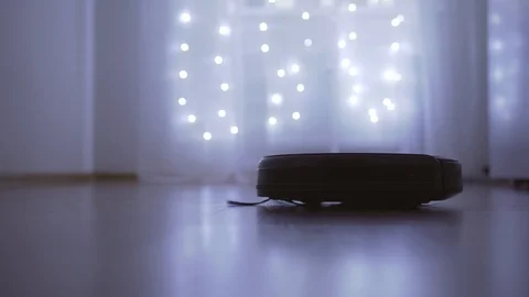 Automatic robot vacuum cleaner rides back and forth Video stock 121313779