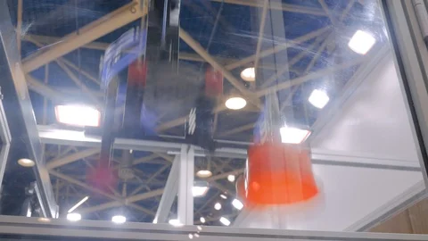 Automatic robotic arm manipulator with suction cups moves plastic pots at fabric Stock Footage 117288048