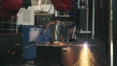 Automatic robotic welding machine is welding sparkling metal sheets in factory. Stock Footage 183444744