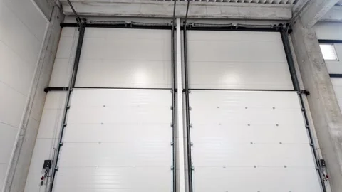 Automatic Roll Cargo Door at Big Warehouse. Stock Footage 317976393