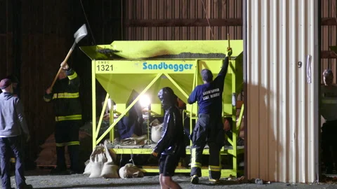 Automatic sandbag filling machine adding up at Abbotsford British Columbia Stock Footage 219311421