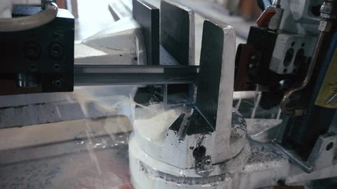 Automatic saw to saw a metal pipe. Automatic Band Saw Stock Footage 116827632