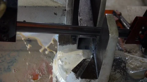 Automatic saw to saw a metal pipe. Automatic Band Saw Stock Footage 116827876