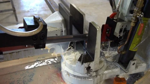 Automatic saw to saw a metal pipe. Automatic Band Saw Stock Footage 116828066
