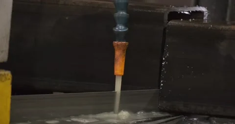 Automatic sawing machine cutting tool raw metal part on industrial band saw Stock-Footage 167338600