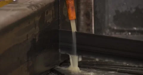 Automatic sawing machine cutting tool raw metal part on industrial band saw Stock Footage 168413736