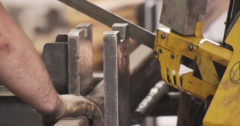 Automatic sawing machine cutting tool raw metal part on industrial band saw Stock Footage 170160764