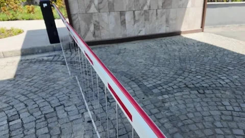 Automatic Security Parking Barrier Gate Closing Outside Building Stock Footage 341589161
