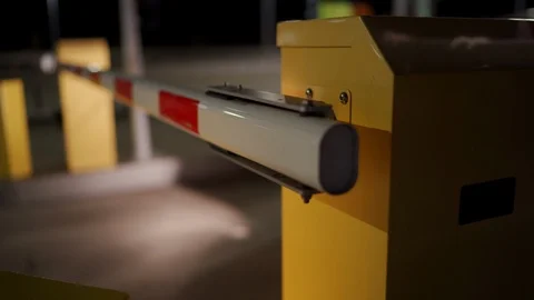 Automatic security system parking boom barrier car park system gate at night Stock Footage 125087603