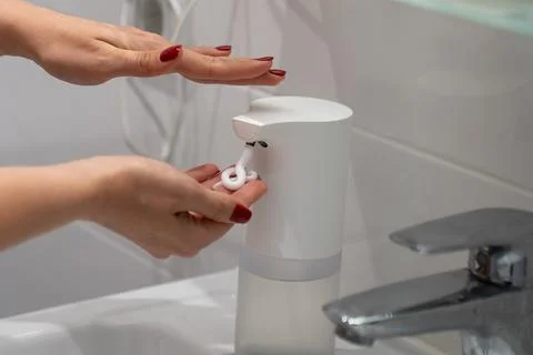 Automatic sensor touchless soap dispenser Stock Photos