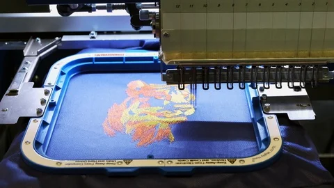 Automatic sewing machine embroidering a lion Stock Footage 112876117