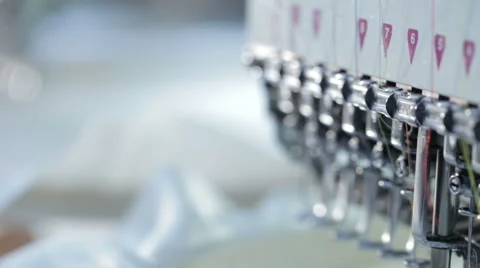 Automatic sewing machine embroiders the butterfly on a white cloth Stock Footage 60131700