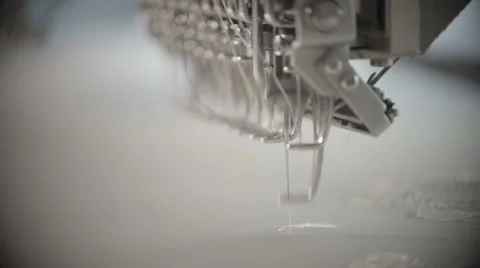 Automatic sewing machine embroiders on white cloth in slow motion Stock-Footage 60131754