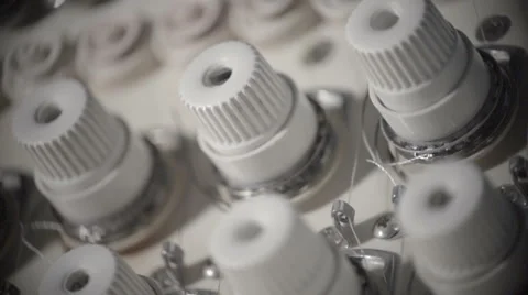 Automatic sewing machine embroiders on white cloth in slow motion Stock Footage 60131805