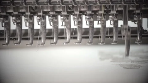 Automatic sewing machine embroiders on white cloth in slow motion Stock Footage 60131871